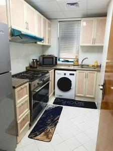 Ajman Family Holiday homes VIP Two rooms, a large hall and a fully equipped kitchen that can accommodate 7 people and children