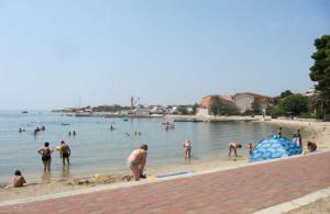 Apartments by the sea Banjol, Rab - 24668 