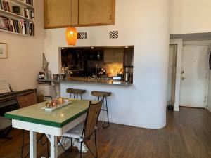 Airy brownstone penthouse duplex near Central Park