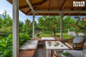 StayVista at Mayflower Aramgarh in middle of Orchards with Lawn, Bonfire, BBQ