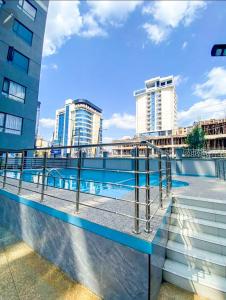 luxurious fully furnished two bedroom apartment with swimming pool fully equipped gym ample parking space children playing ground and unbeatable city views