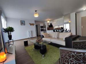 Appartements L-AuthentiCite, jardin et parking au centre-ville : photos des chambres