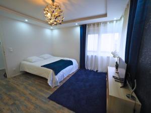 Appartements La Marine by Leslodgespa - Appartement moderne et equipe au style marin, proche de Bale et de l'aeroport : photos des chambres
