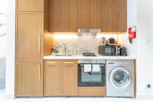 Pool and Community View Studio, Near Top Landmarks, Azizi Riviera 59, Al Merkadh by Deluxe Holiday Homes