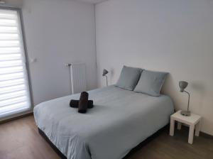 Appartements L-AuthentiCite, jardin et parking au centre-ville : photos des chambres