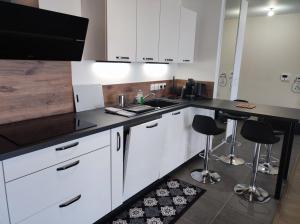 Appartements L-AuthentiCite, jardin et parking au centre-ville : photos des chambres