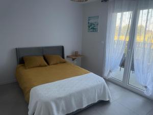 Appartements Appartement plage de debarquement-Asnelles : photos des chambres
