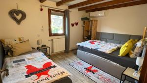 Maisons de vacances GITE LE COQ ROUGE : photos des chambres
