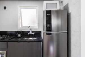 Ap moderno com varanda e churrasqueira, vaga de garagem, próximo da Orla do Guaíba