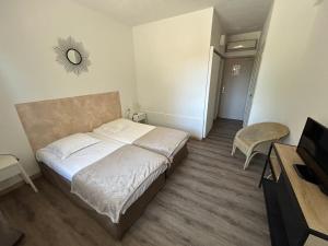 Hotels L'Aiglon Bylitis : photos des chambres
