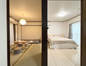AiES Yotsugi, 8-minute walk from Yotsugi Station, 2 bedrooms, 4 rooms, free parking, direct access to the airport, Tokyo Skytree, Asakusa, Ginza, near shopping malls, parks, and the hometown of Tsubasa Ozora