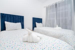 Glorious Garden, Appartement Familial, Face au Stade Ibn Batouta, Espaces Verts, Proche Aéroport, Parking, WIFI, AC, IPTV