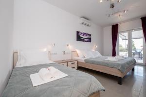 Apartments by the sea Banjol, Rab - 21635