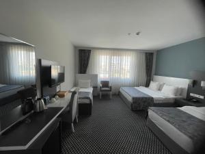 Standard Quadruple Room room in Cavit Duvan Prestige Hotel