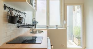 Appartements Confort - RDC - WIFI - Lave-linge & Terrasse : photos des chambres