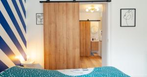 Appartements Confort - RDC - WIFI - Lave-linge & Terrasse : photos des chambres