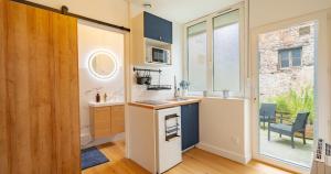 Appartements Confort - RDC - WIFI - Lave-linge & Terrasse : photos des chambres