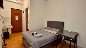 RoomQu at Ecohome Citra Raya