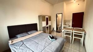 RoomQu at Ecohome Citra Raya