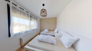 Villas 4 chambres - 200m2 - Parking - Jardin : photos des chambres