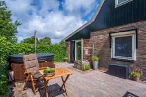 Gastsuite het Duinroosje met hottub op het privé terras!