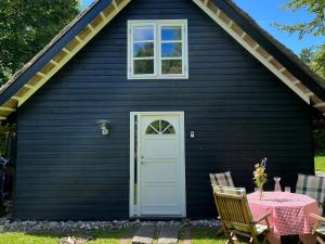 Be Surrounded By Trees In A Thatched Cottage