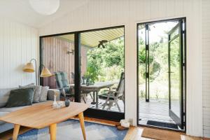 The Red Summer House With The Lush Garden At Asnæs