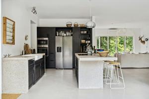 Home With Panoramic Windows And Stones