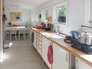 Cottage In Woodland Garden In Natural Harmony