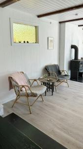 Home With Recycled Finds Near Nature