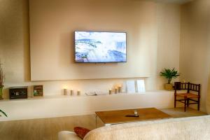 Appartements Escapade en famille en appartement - Cine prive, balneo et jardin : photos des chambres