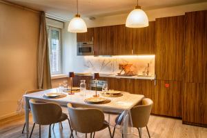 Appartements Escapade en famille en appartement - Cine prive, balneo et jardin : photos des chambres