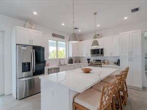 Seaside Serenity - Luxury Waterfront Pool Home, 35` Dock