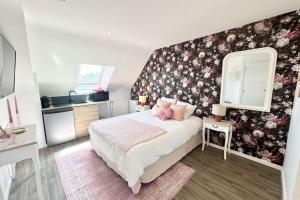 Appartements L’instant rose - Cocon fleuri avec jacuzzi : photos des chambres