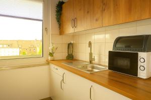 Livemore24 - Apartment 2 in Duisburg WLAN - Smart-TV - 24-7 Check-in und Küche