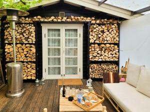 Black-Painted Log House Overlooking Vejle Fjord