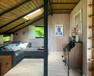 Black Wooden Cottage Near Forest And Beach