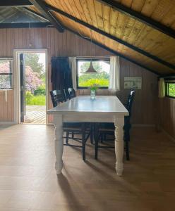 Black Wooden Cottage Near Forest And Beach