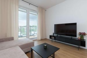 Family Apartment in Gdynia with Parking and Playground by Noclegi Renters