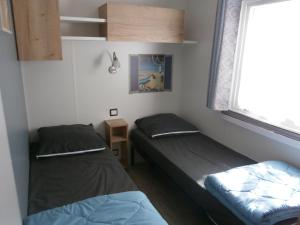 Campings Mobilhome 3 chambres tout confort, proche de la plage : photos des chambres