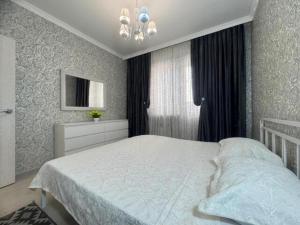 Apartment opposite Almaty Arena 13-64