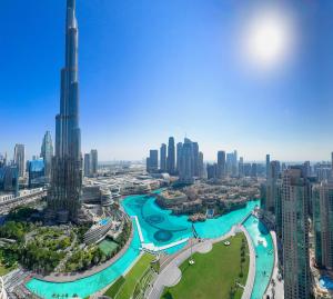 GRANDE SIGNATURE with a direct Burj Khalifa view and Private Fountain Show at high floor with DXB AIRPORT VIP Shuttle option for 6 guests