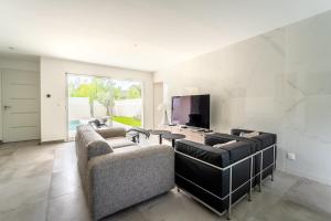 Villas Villa climatisee avec piscine et stationnements : photos des chambres