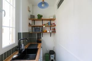 Appartements Bright studio 10 minutes by subway from Paris : photos des chambres