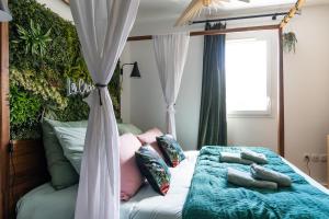 Appartements La Cachette des amoureux balneo en duo : photos des chambres