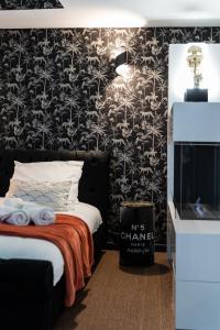 Appartements La Charmeuse, suite luxueuse romantique & spa : photos des chambres