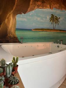 Appartements La Caliente love room glamour balneo en duo : photos des chambres