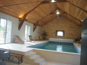 Maisons de vacances La Grange Flor-Alie gite et piscine interieure : photos des chambres