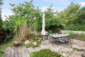 Lovely Beach Home Enveloped In Green Surroundings