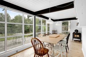 Lovely Beach Home Enveloped In Green Surroundings